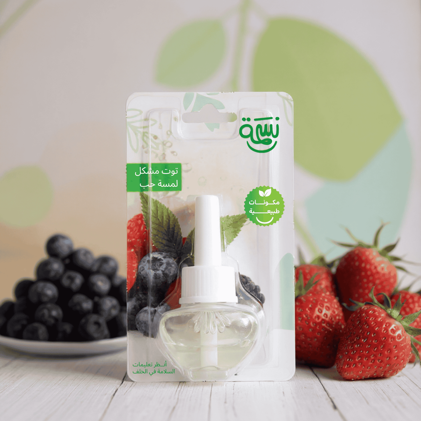 Fragrance refill bottle with mixed berries including strawberries, raspberries, and blueberries in a fresh clean background

