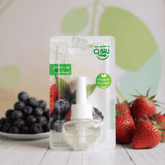 Fragrance refill bottle with mixed berries including strawberries, raspberries, and blueberries in a fresh clean background

