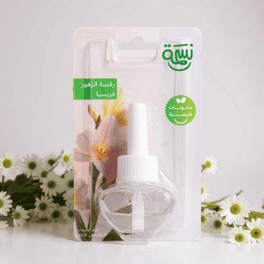 Fragrance refill with soft freesia flowers in a fresh floral background and minimal white surface

