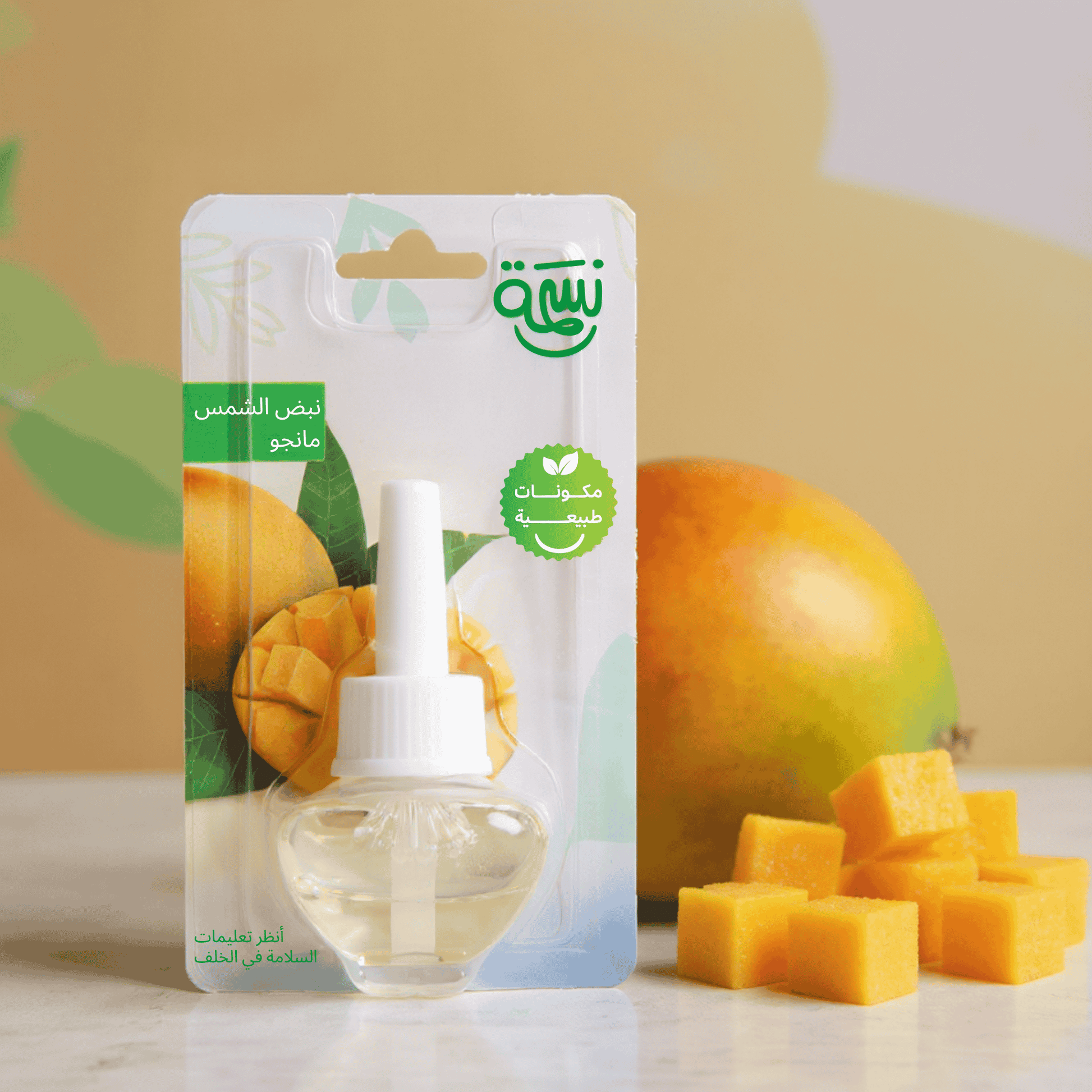 Mango-scented fragrance refill bottle with ripe mango cubes and tropical yellow-orange background

