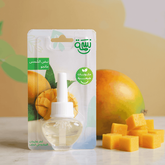 Mango-scented fragrance refill bottle with ripe mango cubes and tropical yellow-orange background

