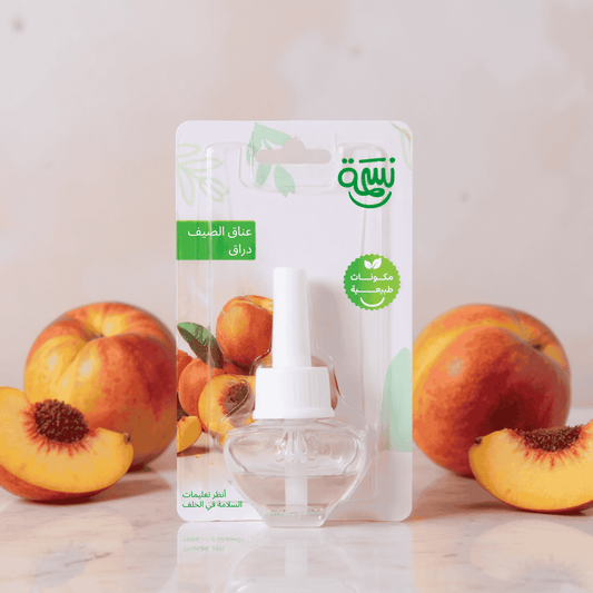 Peach-scented fragrance refill bottle with sliced and whole peaches on a marble surface and soft peach-toned background

